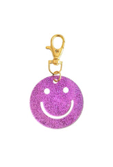 Lymaja Glitzer Smiley Schlüsselanhänger in lila magenta