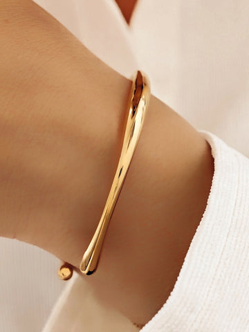 Goldener geometrischer ung geschwungener Damen Armreif aus Edelstahl - Lymaja