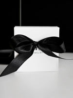 Geschenkverpackung mit Schleife