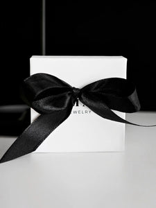 Geschenkverpackung mit Schleife