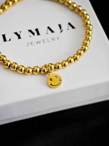 Smiley Perlenarmband in gold mit 4mm Edelstahl Perlen auf ein Gummiband gezogen für Frauen von Lymaja Jewelry